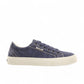 Taos Plim Soul blue wash canvas sneaker with thick rubber platform and decorative zigzag stitching. Photo of side view.