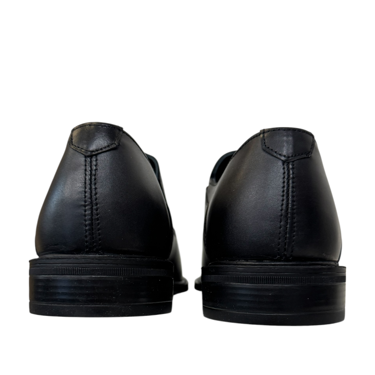 Borna Barbod black leather slip-on dress shoes for men with a durable rubber outsole. Photo of back view.