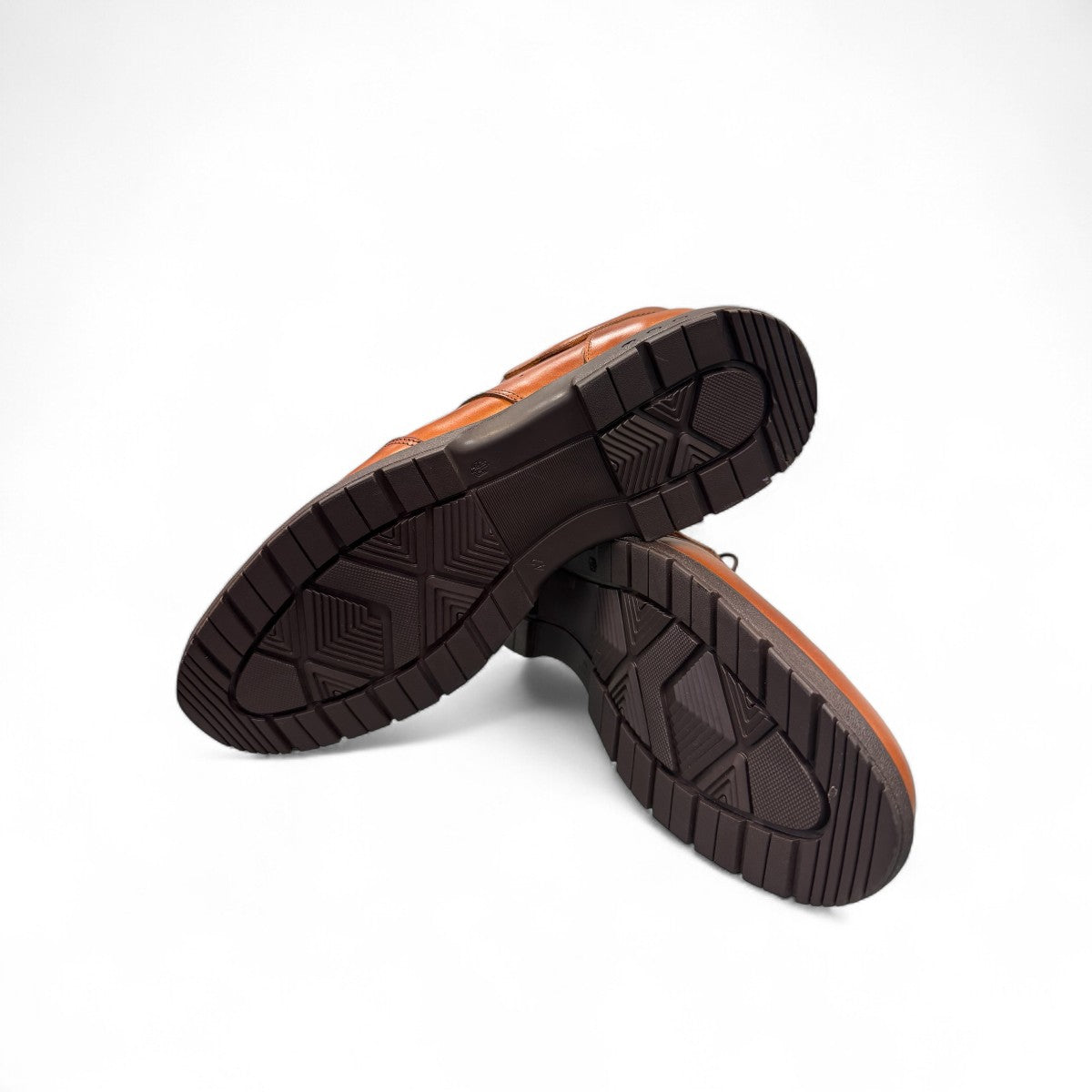BORNA BORNA brown leather men's dress shoes with perforated side detailing and a durable rubber outsole. Photo of bottom view.