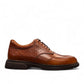 BORNA BORNA brown leather men's dress shoes with perforated side detailing and a durable rubber outsole. Photo of right side view.