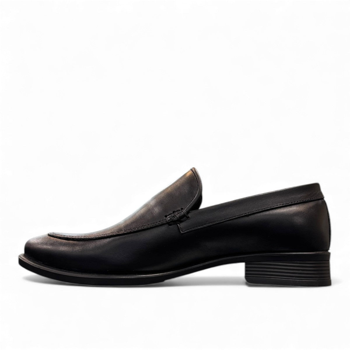 Borna Darakeh black leather loafers for men with a durable rubber outsole and sleek slip-on design. Photo of left side view.