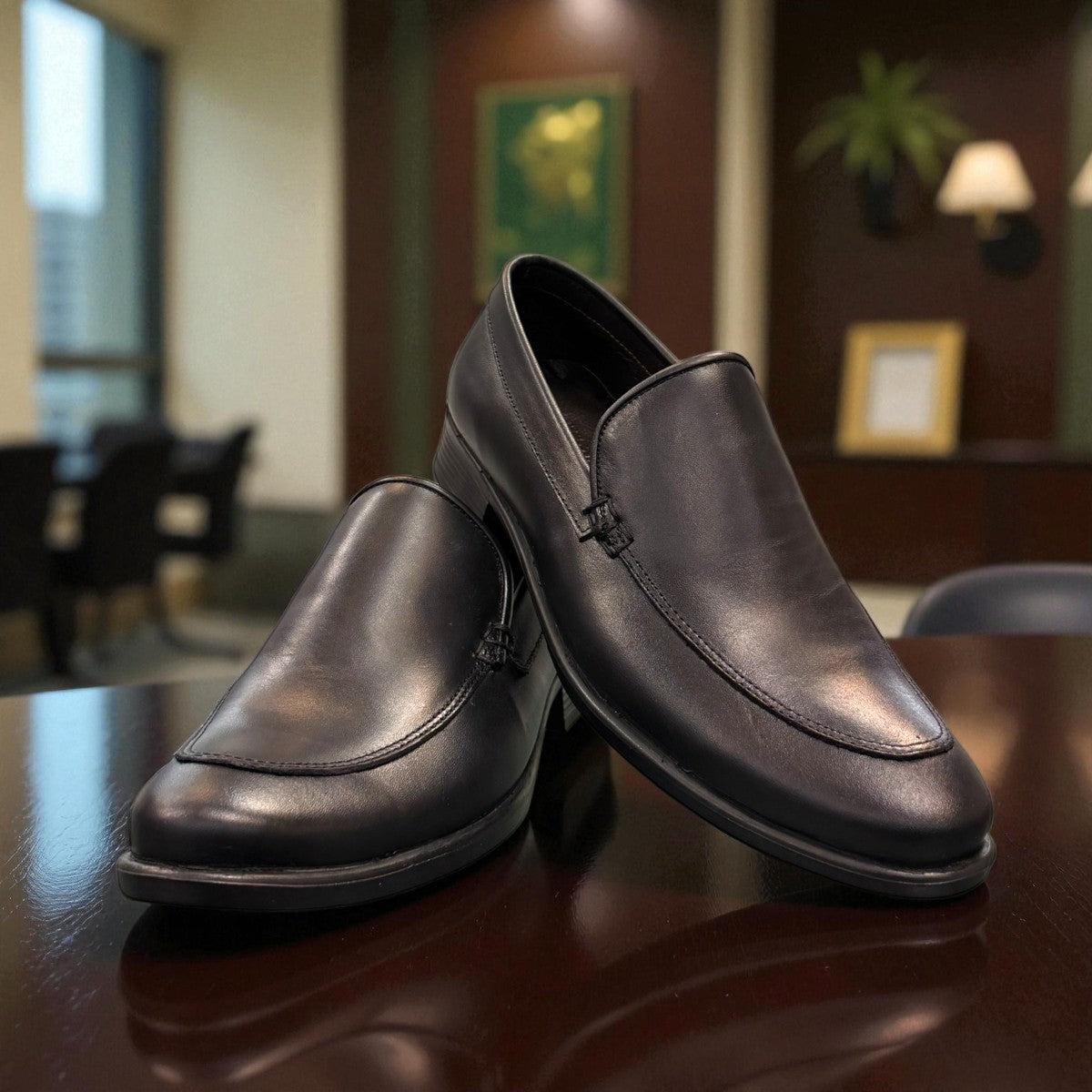 Borna Darakeh black leather loafers for men with a durable rubber outsole and sleek slip-on design. Photo of upper view.