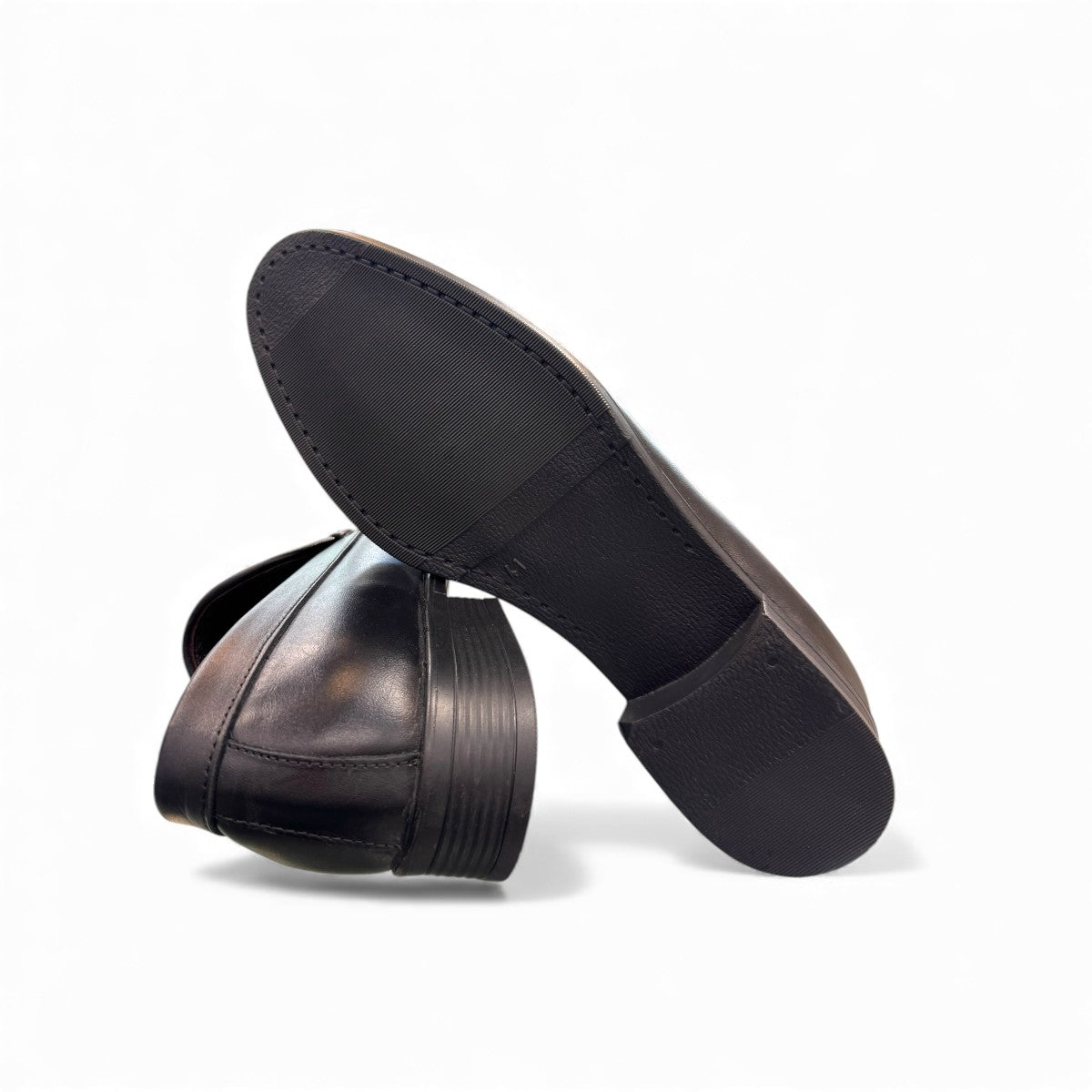 Borna Darakeh black leather loafers for men with a durable rubber outsole and sleek slip-on design. Photo of bottom view.