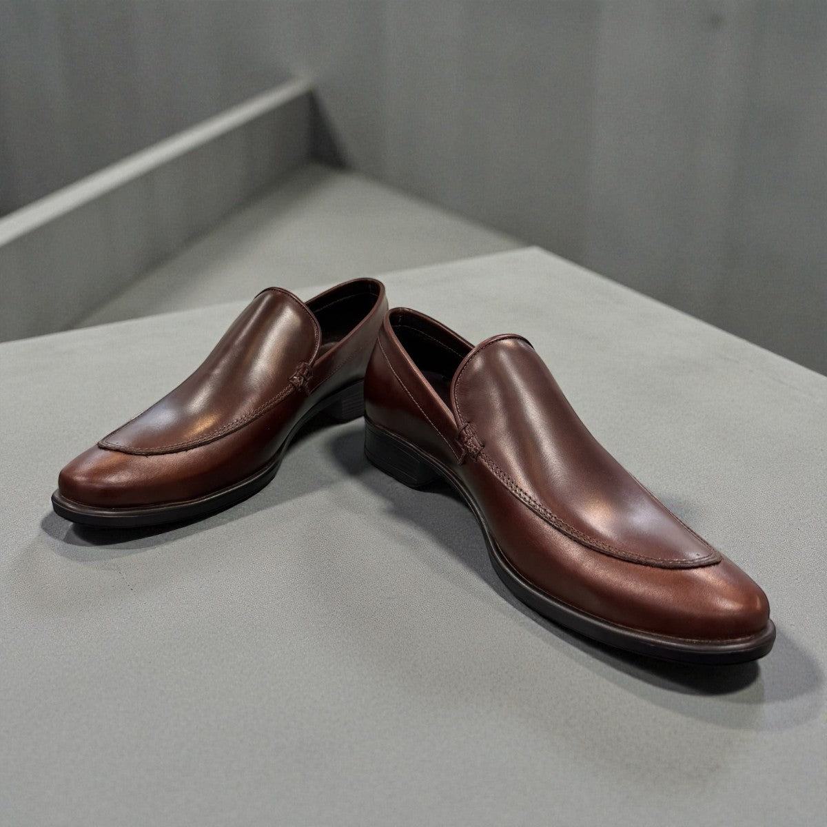 BORNA DARAKEH dark brown leather loafers for men with a durable rubber outsole and sleek slip-on design. Photo of front side view.