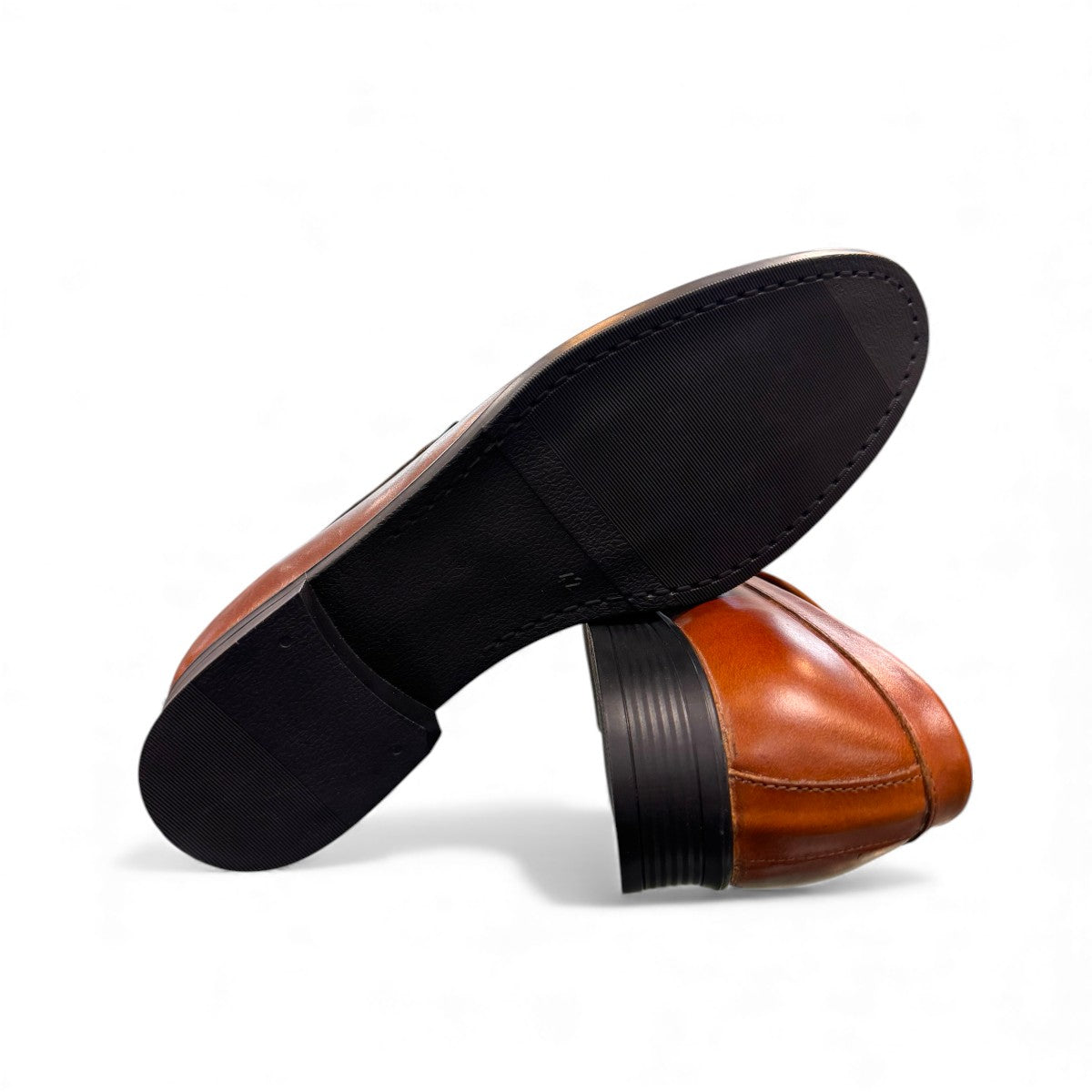 Borna Darakeh light brown leather loafers with a sleek profile and durable rubber outsole. Photo of bottom view.