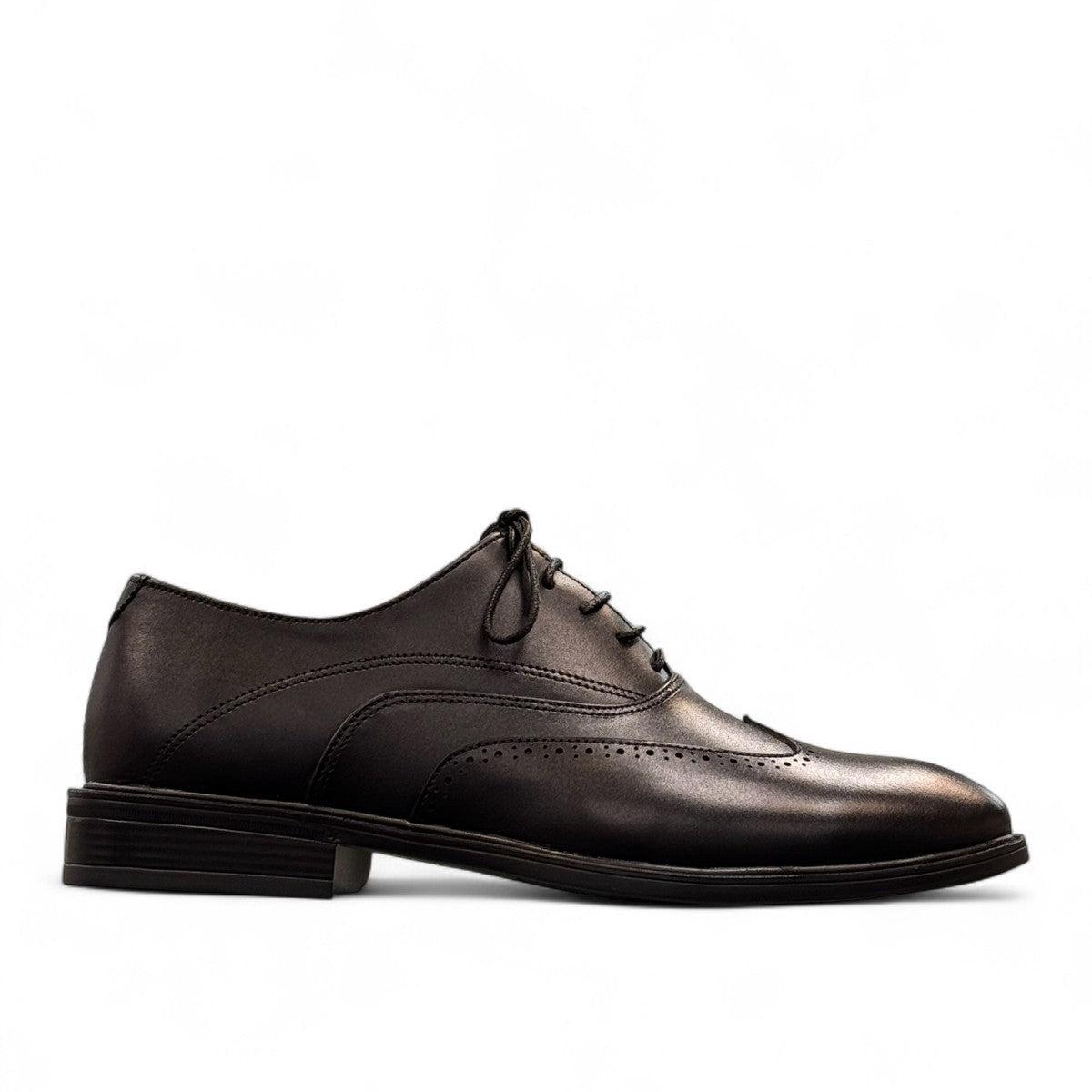 BORNA DRESSY black leather oxford shoes with brogue detailing and a durable rubber outsole. Photo of right side view.