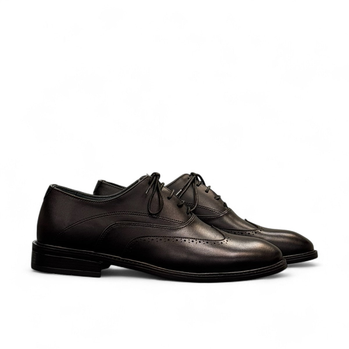 BORNA DRESSY black leather oxford shoes with brogue detailing and a durable rubber outsole. Photo of side views 1.