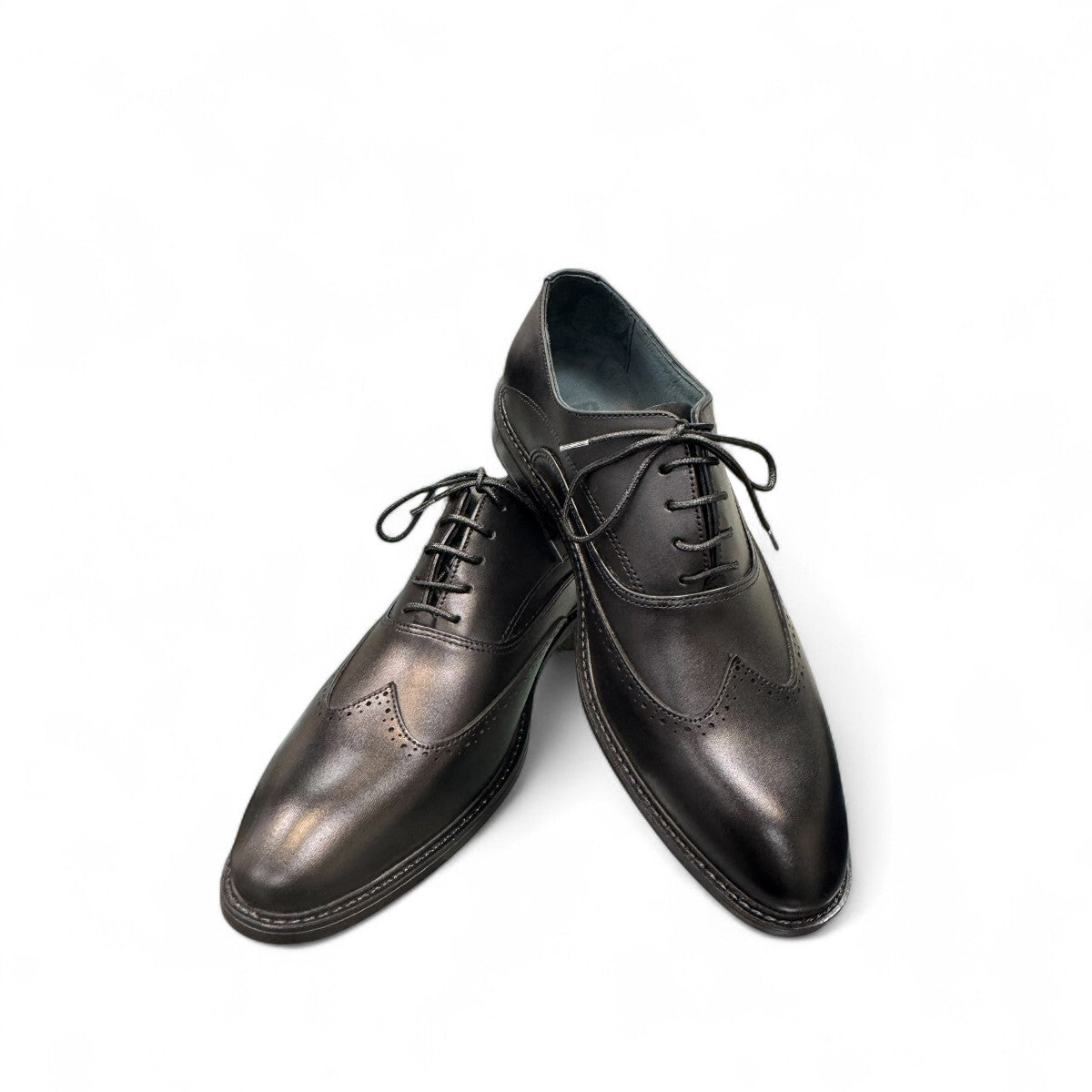 BORNA DRESSY black leather oxford shoes with brogue detailing and a durable rubber outsole. Photo of front side view.