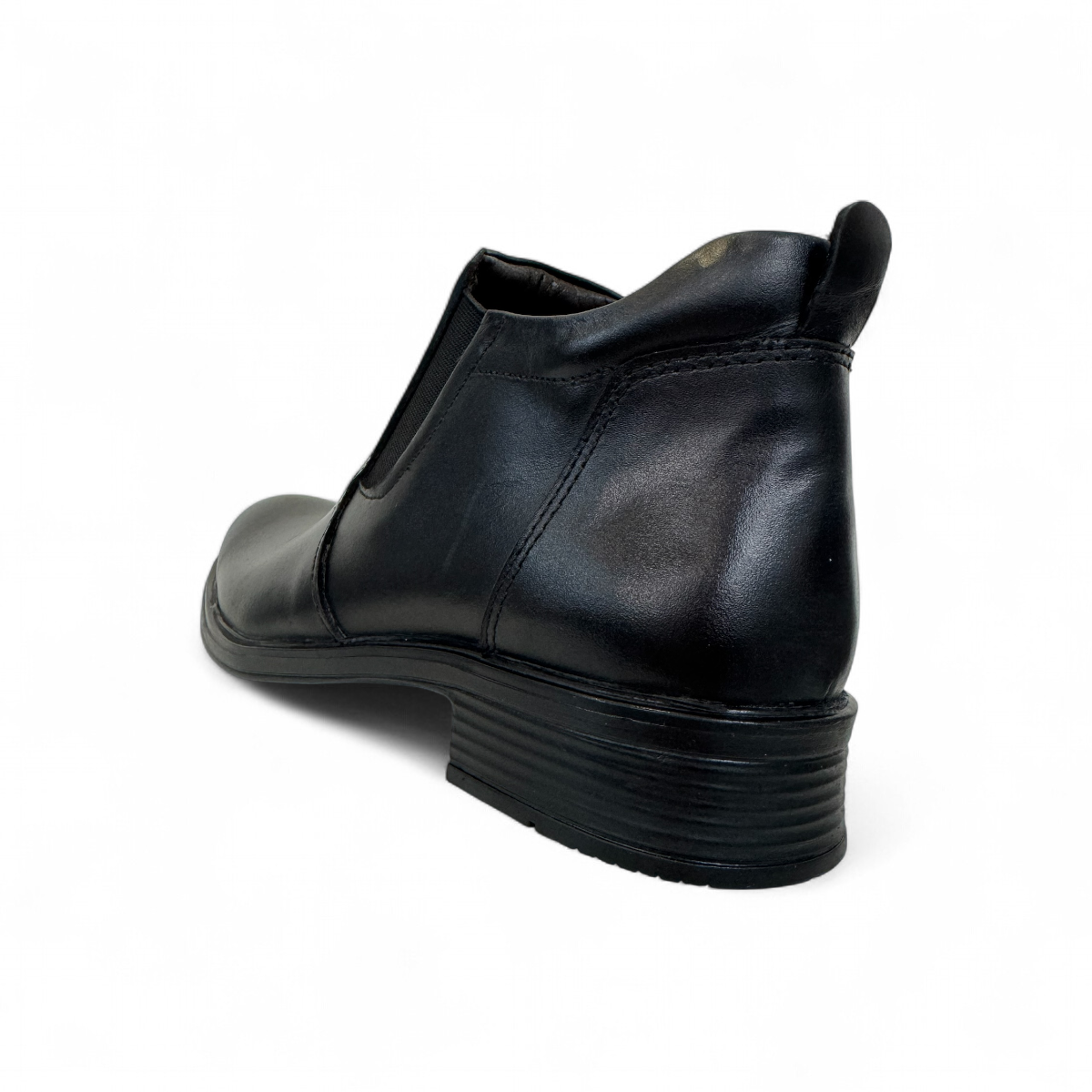 Borna Golestan black leather slip-on men's boots with a durable rubber outsole and side elastic panels. Photo of back side view.