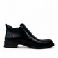 Borna Golestan black leather slip-on men's boots with a durable rubber outsole and side elastic panels. Photo of left side view.