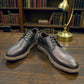 Borna Khayyam black leather men's lace-up shoe with a durable rubber outsole and side branding. Photo of front side view 1.