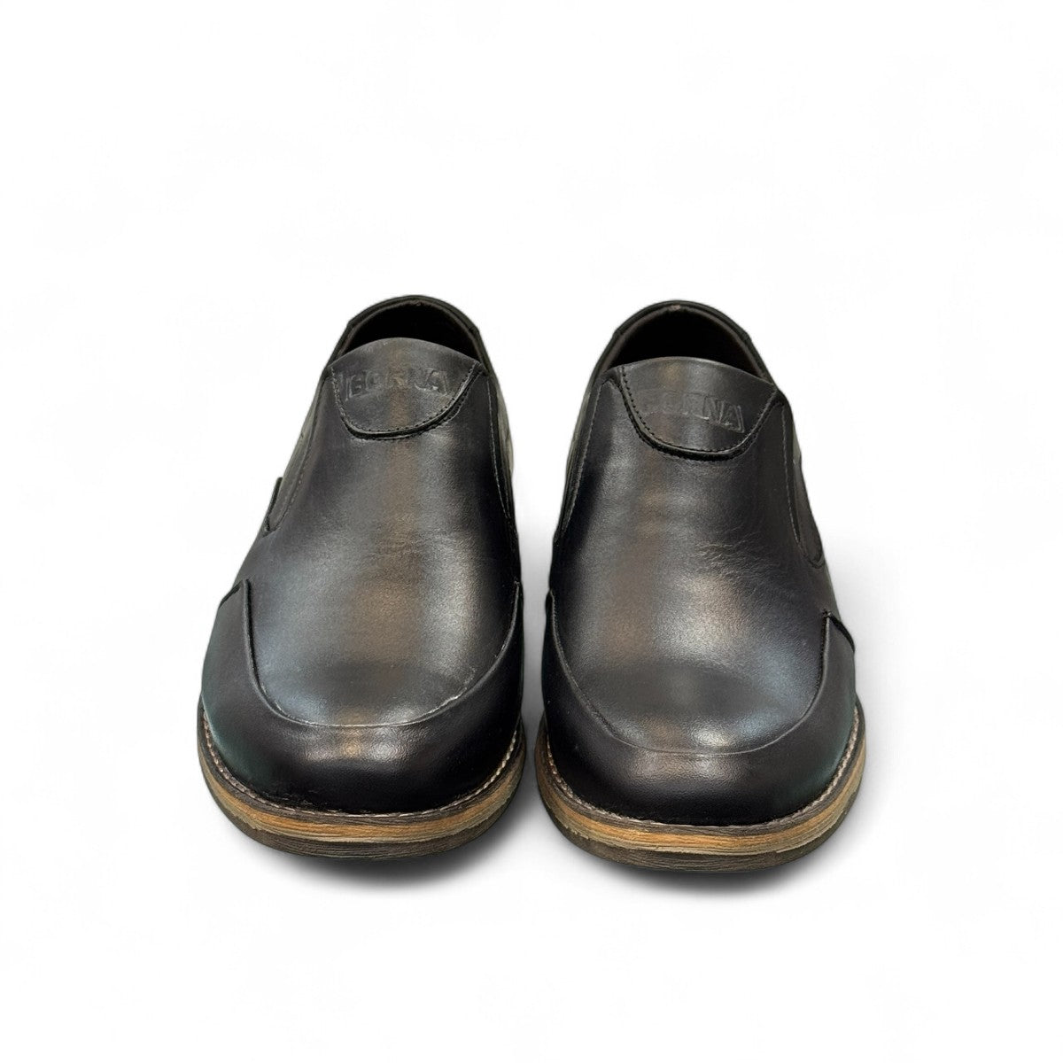 Borna Sadabad black leather slip-on men's shoes with a durable rubber outsole and minimalist design. Photo of front view 1.