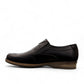 Borna Sadabad black leather slip-on men's shoes with a durable rubber outsole and minimalist design. Photo of left side view.