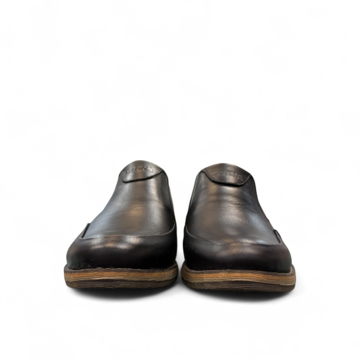 Borna Sadabad black leather slip-on men's shoes with a durable rubber outsole and minimalist design. Photo of front view 2.