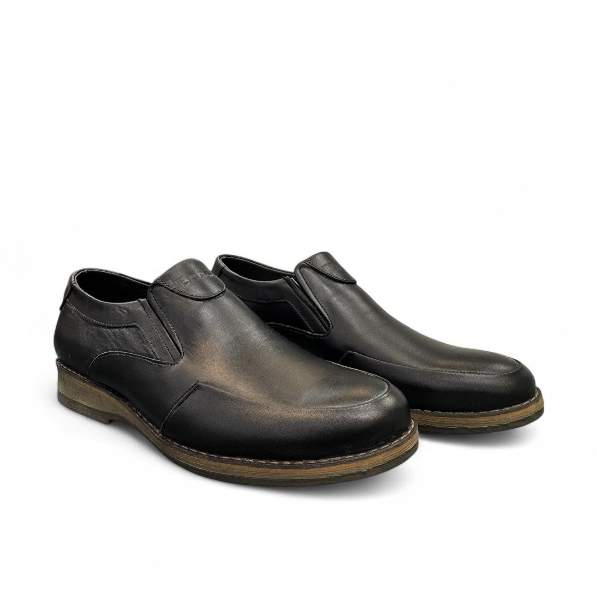 Borna Sadabad black leather slip-on men's shoes with a durable rubber outsole and minimalist design. Photo of side views.