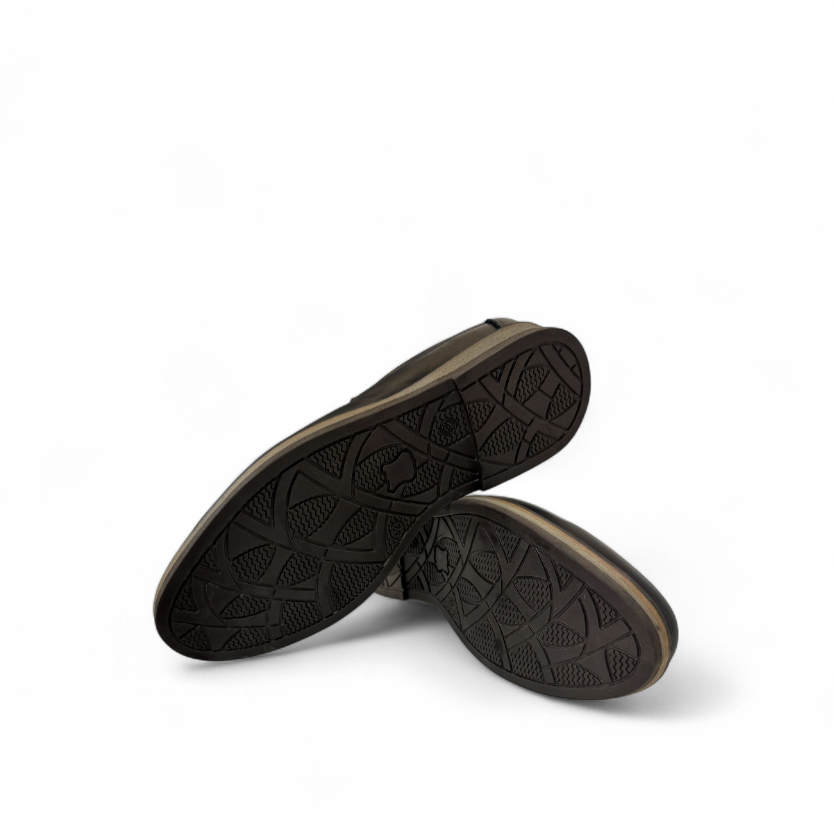 Borna Shams black leather slip-on men's shoe with a rubber outsole and embossed side logo. Photo of bottom view.