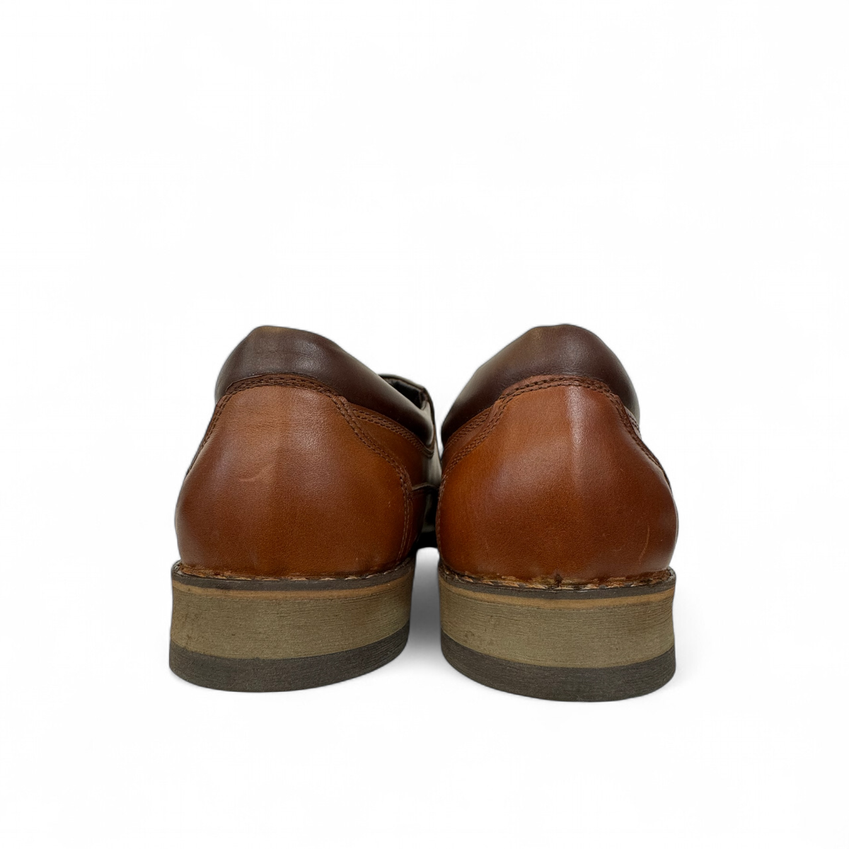 Borna Shams brown leather slip-on men's shoes with a rubber outsole and side branding detail. Photo of back view.