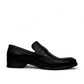 Borna Tajrish black leather loafers for men with a rubber outsole and metal detail. Photo of left side view.