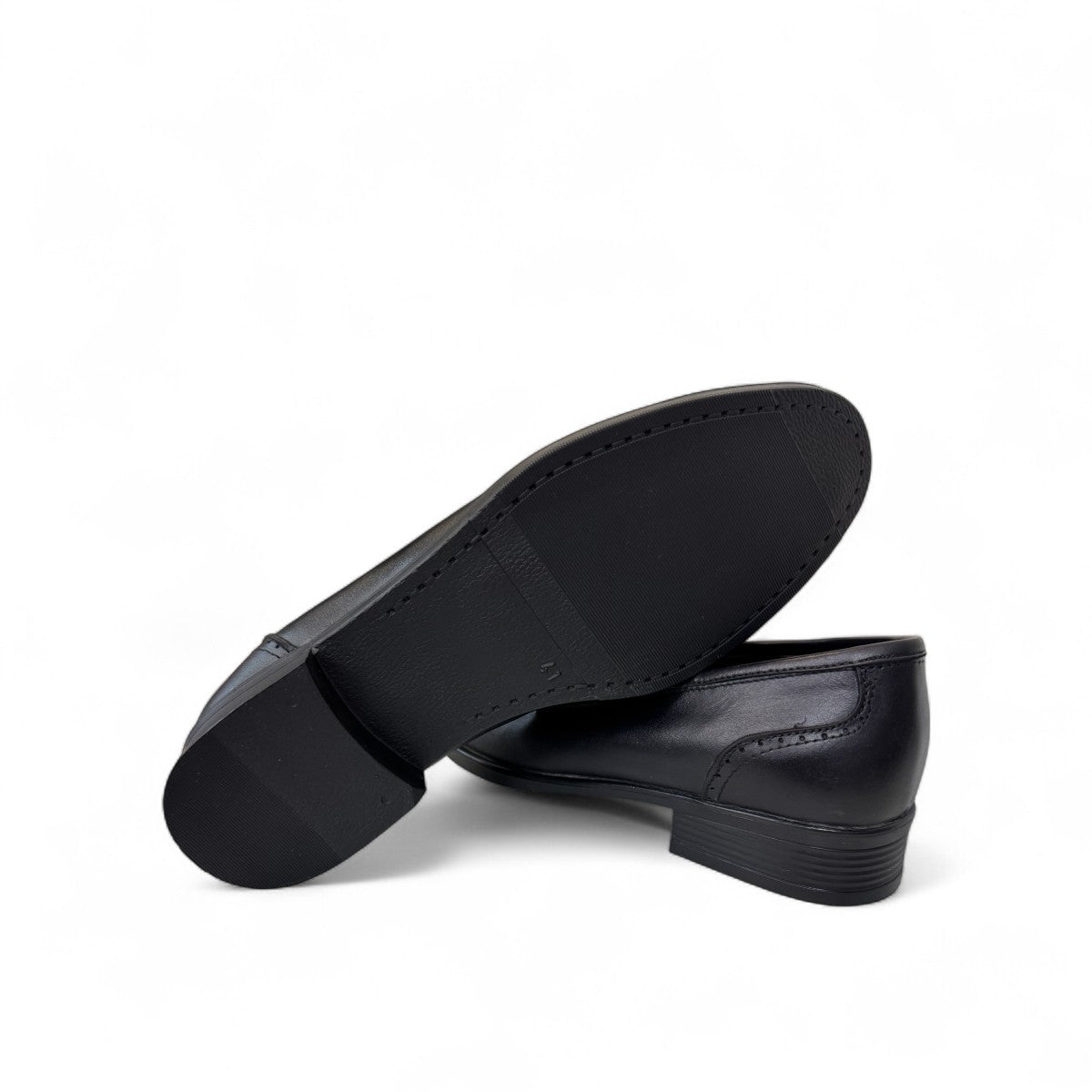 Borna Tajrish black leather loafers for men with a rubber outsole and metal detail. Photo of bottom view.