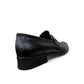 Borna Tajrish black leather loafers for men with a rubber outsole and metal detail. Photo of back side view.