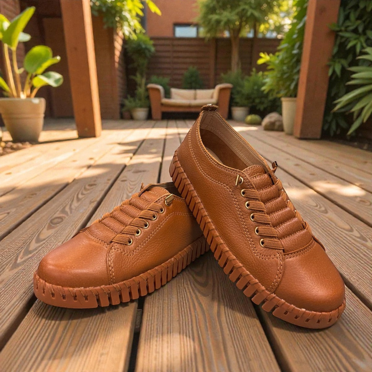 Bottero Garry slip-on shoe in caramel leather with a textured rubber sole and gold eyelet details.