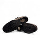 Canada Comfort black waterproof ankle boot with velcro strap and faux fur trim for winter traction. Photo of bottom view.