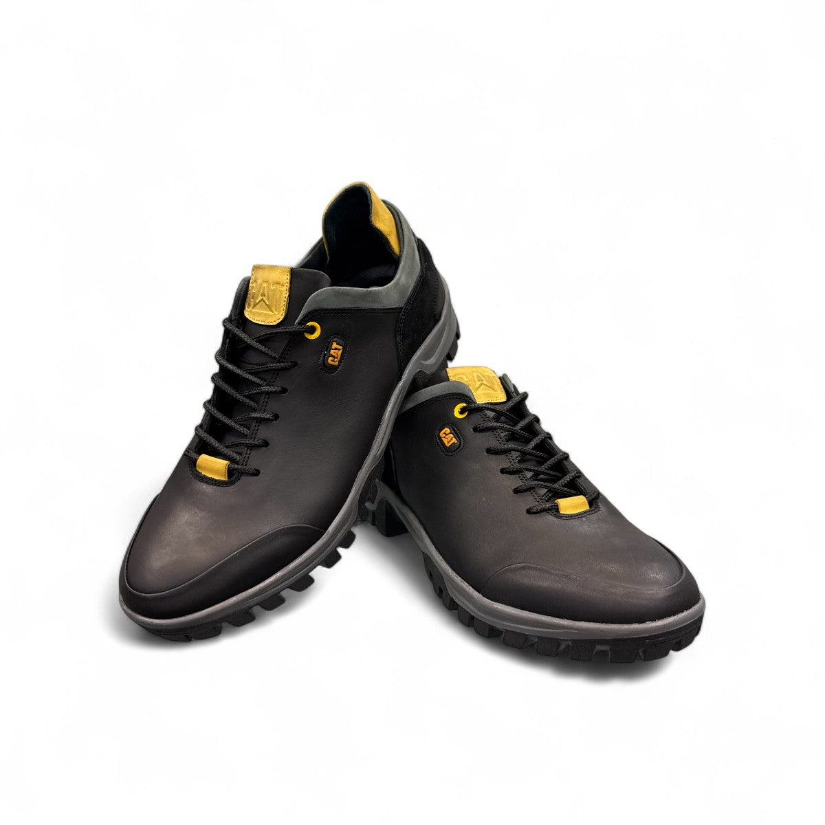 CAT black nubuck leather lace-up sneaker with a durable rubber outsole and handmade stitching detail. front view.