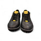 CAT black nubuck leather lace-up sneaker with a durable rubber outsole and handmade stitching detail. front view.