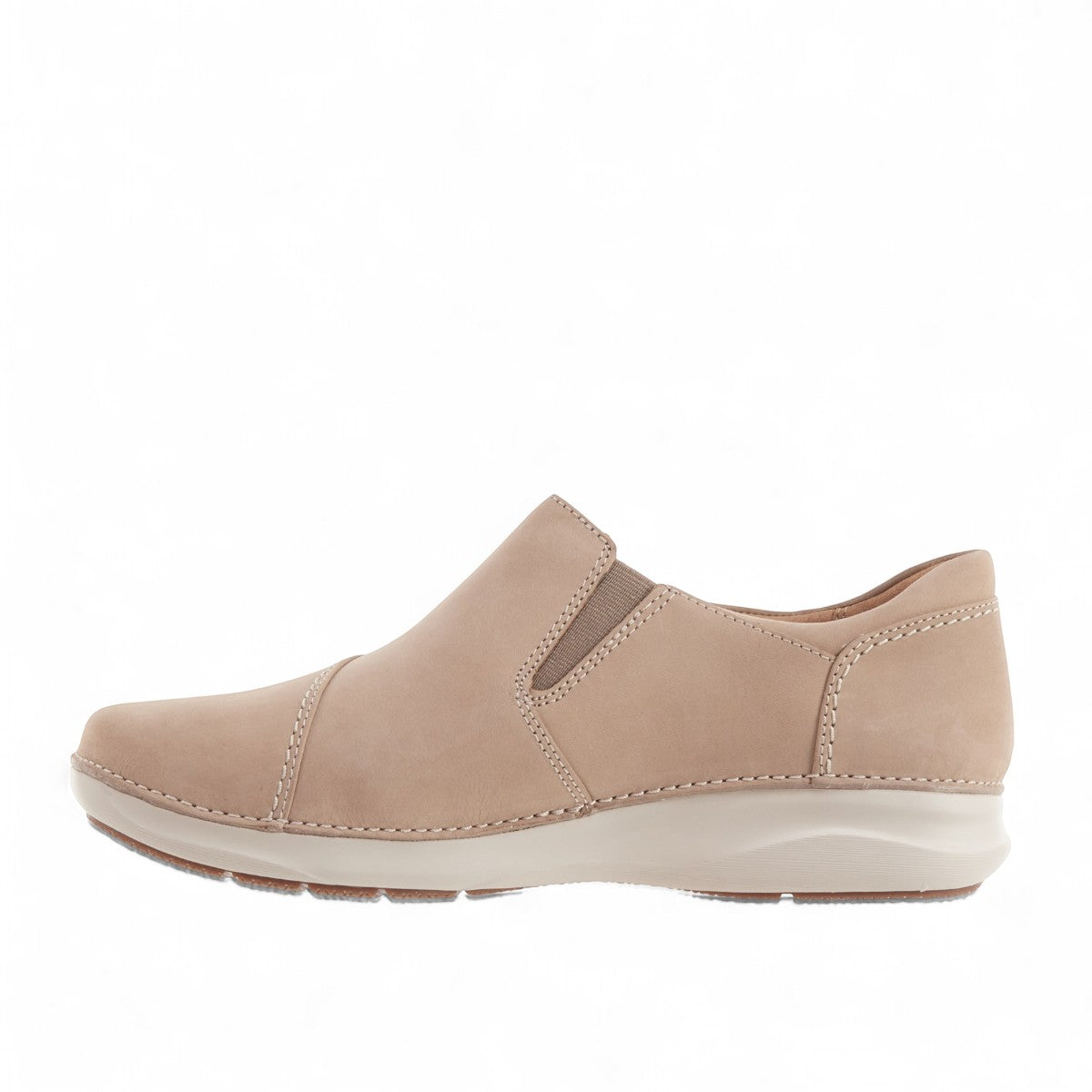 Clarks Appley Zip slip-on shoes in sand nubuck leather with side zipper and cushioned sole. left view.