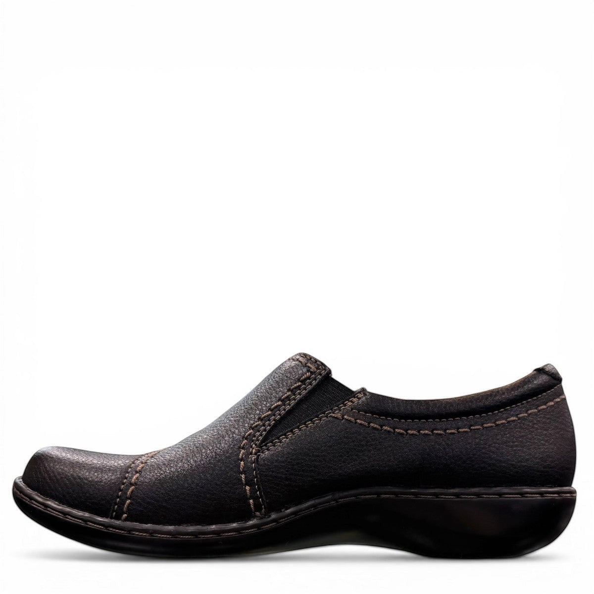 Clarks Ashland Effie black leather slip-on shoe with round toe and decorative button detail. left view.