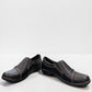 Clarks Ashland Effie black leather slip-on shoe with round toe and decorative button detail. front view.