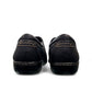 Clarks Ashland Lane Q black leather slip-on shoe with decorative buttons and contrast stitching. back view.