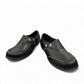 Clarks Ashland Lane Q black leather slip-on shoe with decorative buttons and contrast stitching. front view.
