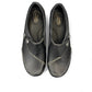 Clarks Ashland Lane Q black leather slip-on shoe with decorative buttons and contrast stitching. top view.