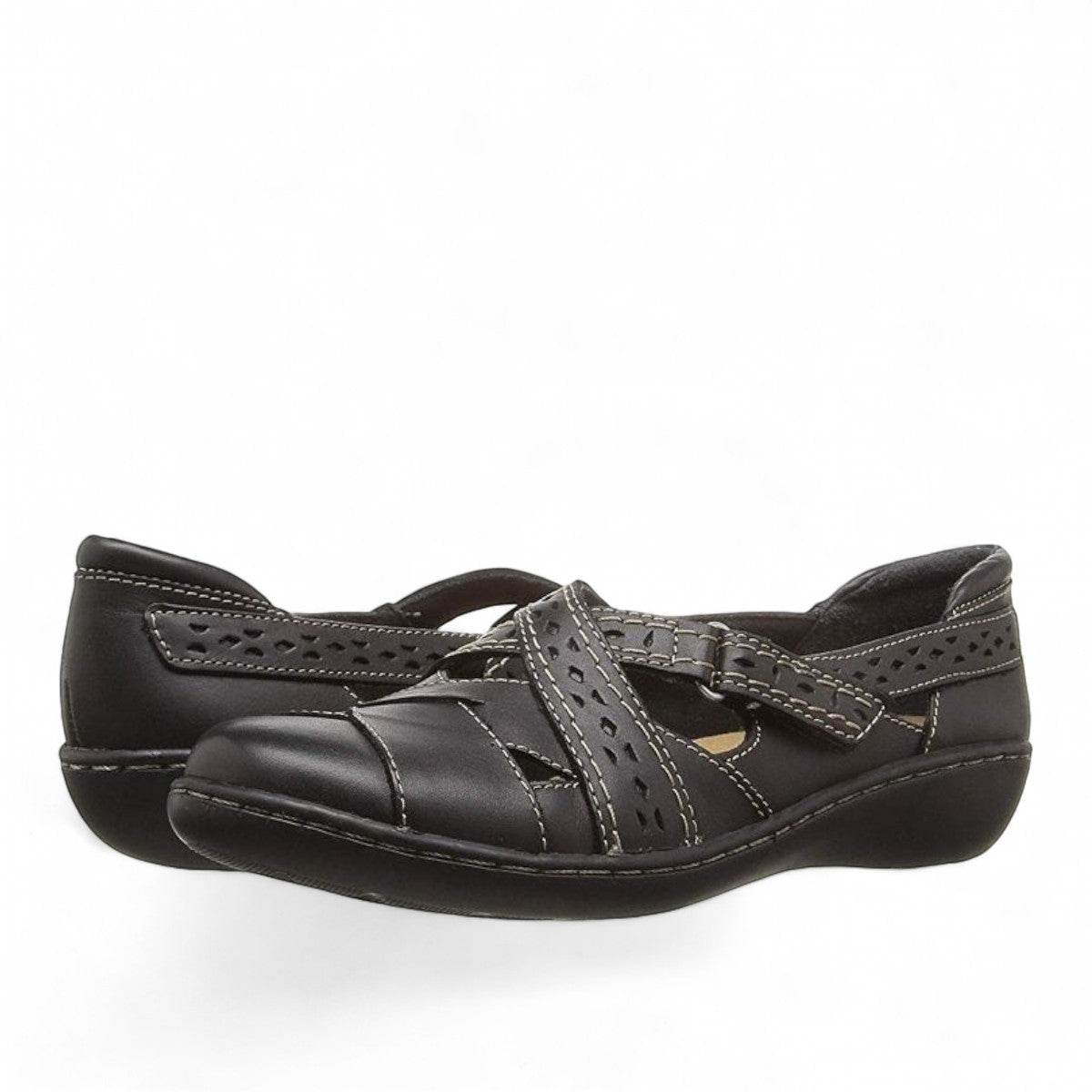 Clarks Ashland Spin Q black leather slip-on shoe with crisscross straps and contrast stitching. front view.
