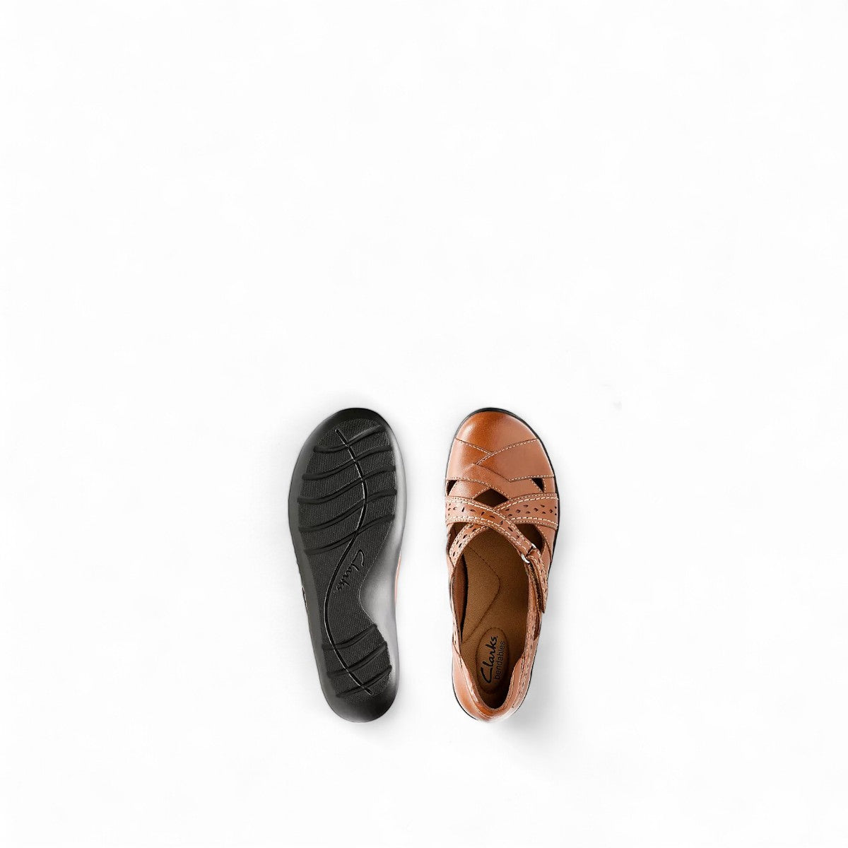 Clarks Ashland Spin Q tan leather slip-on shoe with crisscross straps and contrast stitching. top view.