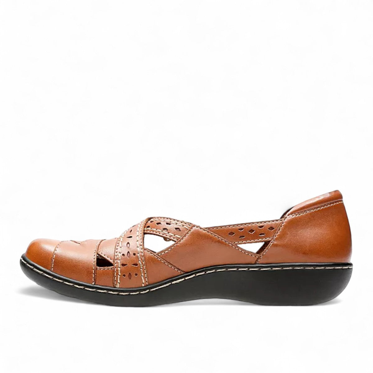 Clarks Ashland Spin Q tan leather slip-on shoe with crisscross straps and contrast stitching. left view.