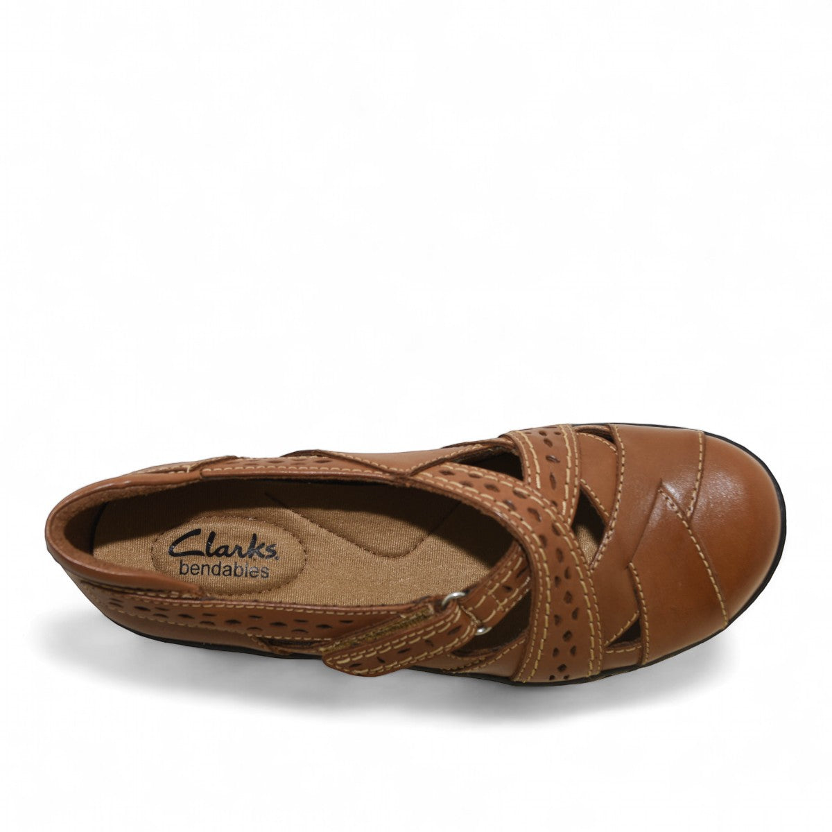 Clarks Ashland Spin Q tan leather slip-on shoe with crisscross straps and contrast stitching. top view.