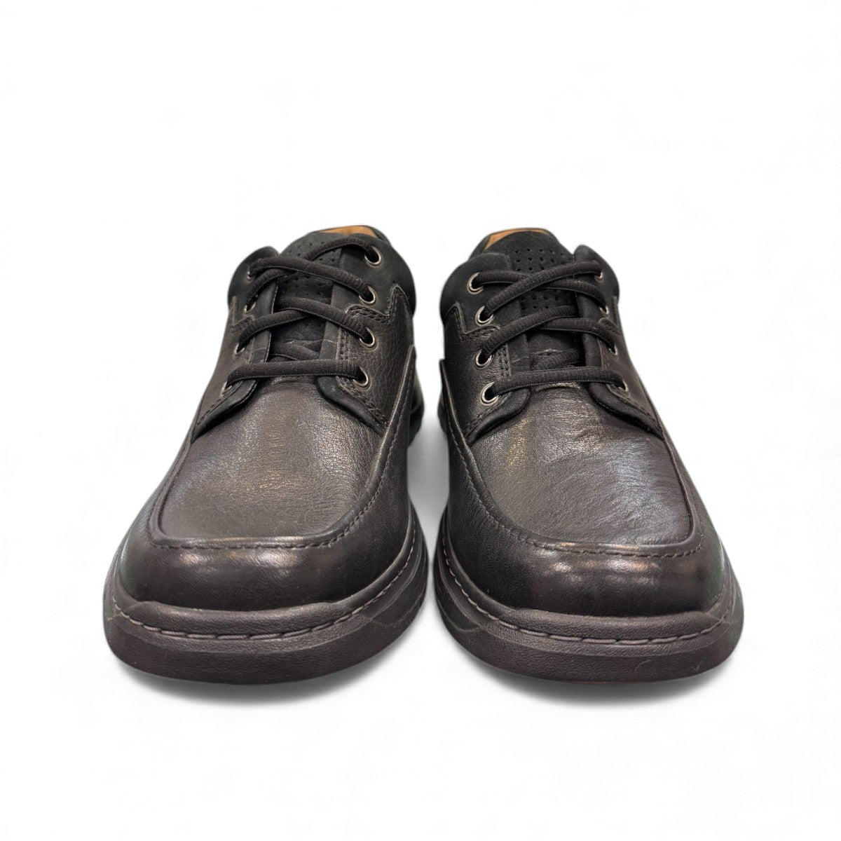 Clarks Un Brawley Lace black leather casual shoe with stitch detailing and a flexible sole. front view.