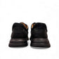 Clarks Un Brawley Lace black leather casual shoe with stitch detailing and a flexible sole. back view.