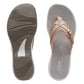Clarks Breeze Sea beige flip-flops with a lightweight sole and adjustable strap closure for summer wear. top view.