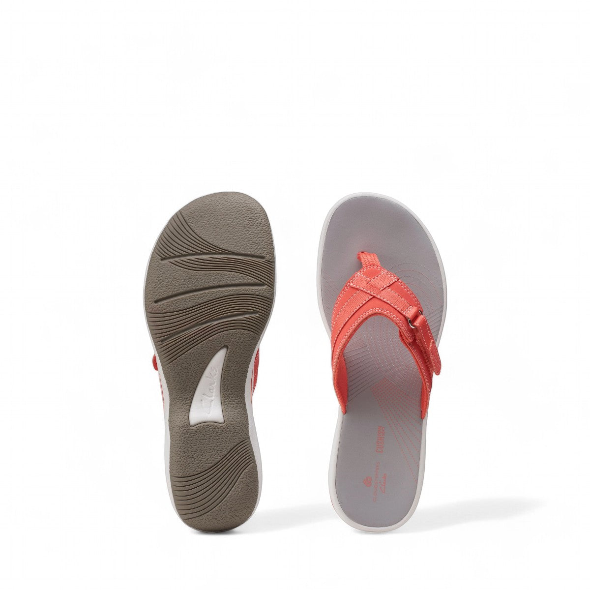 Clarks Breeze Sea bright coral flip-flops with a lightweight sole and adjustable strap closure. photo of the bottom.
