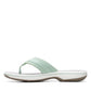 Clarks Breeze Sea flip-flops in pale green with a lightweight sole and adjustable strap closure. left view.