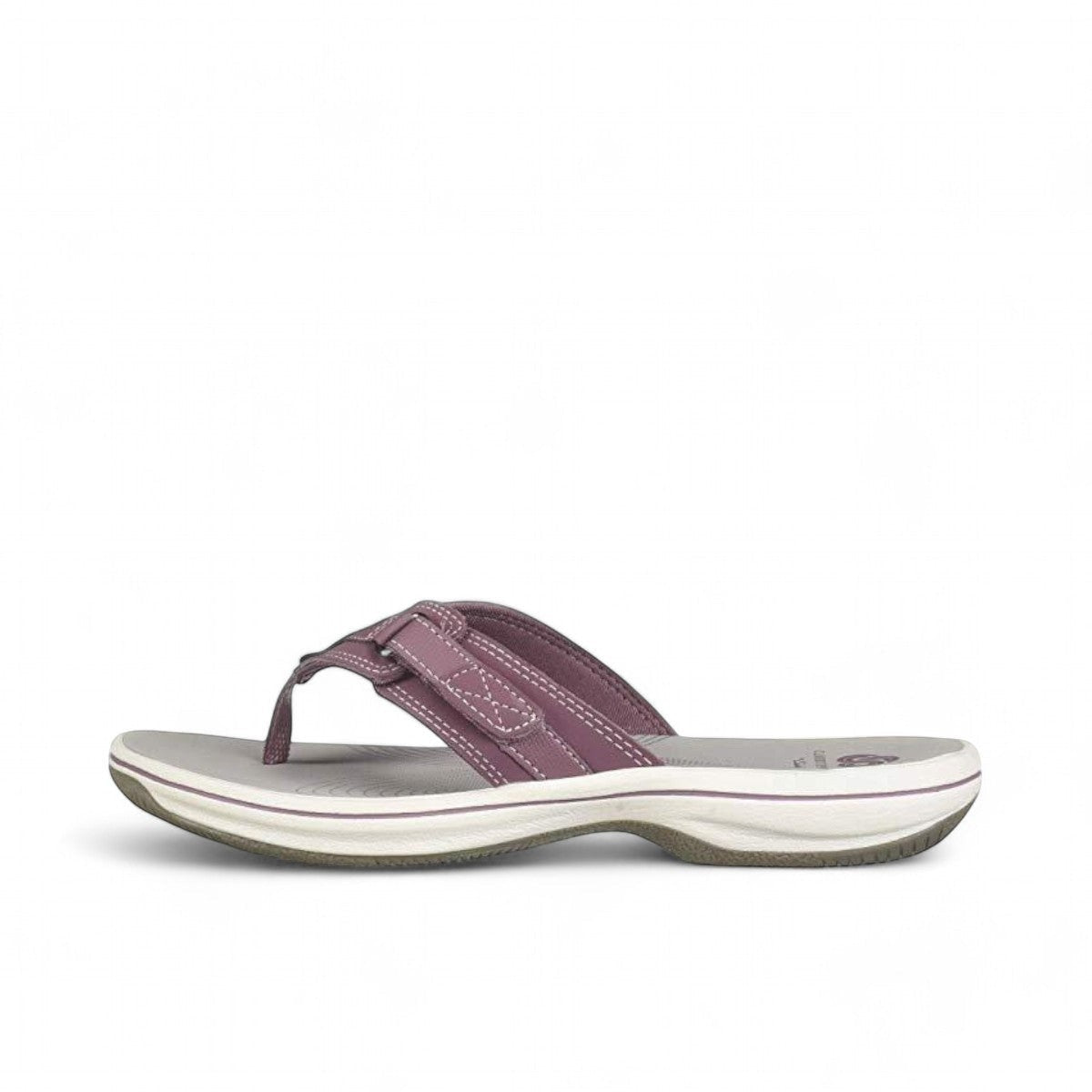 Sina Footwear Clarks Breeze Sea purple flip-flops with a lightweight sole and adjustable strap closure. Photo of left side.