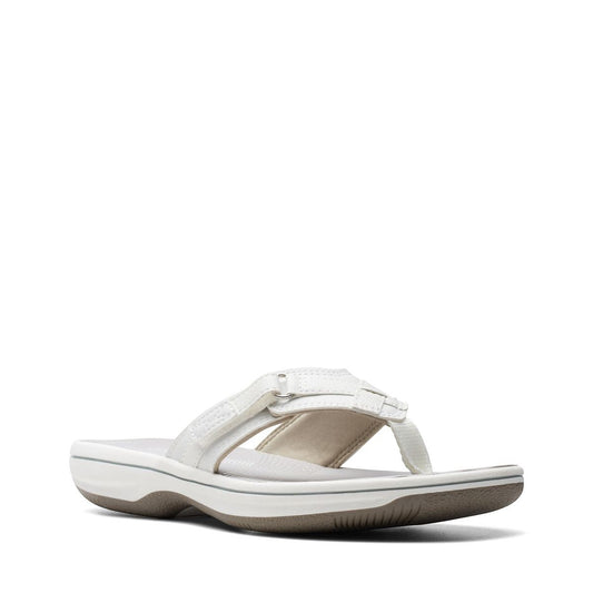 Clarks Breeze Sea white synthetic flip-flops with a subtle strap closure and lightweight sole. front view.