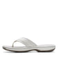 Clarks Breeze Sea white synthetic flip-flops with a subtle strap closure and lightweight sole. left view.