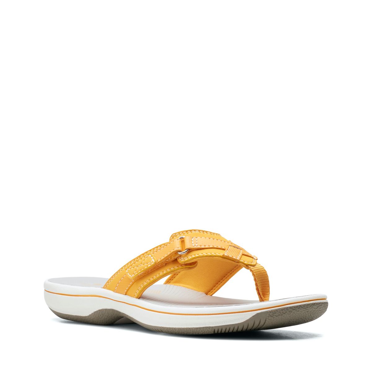 Clarks Breeze Sea flip-flops in burnt yellow with a lightweight sole and adjustable strap closure. front view.