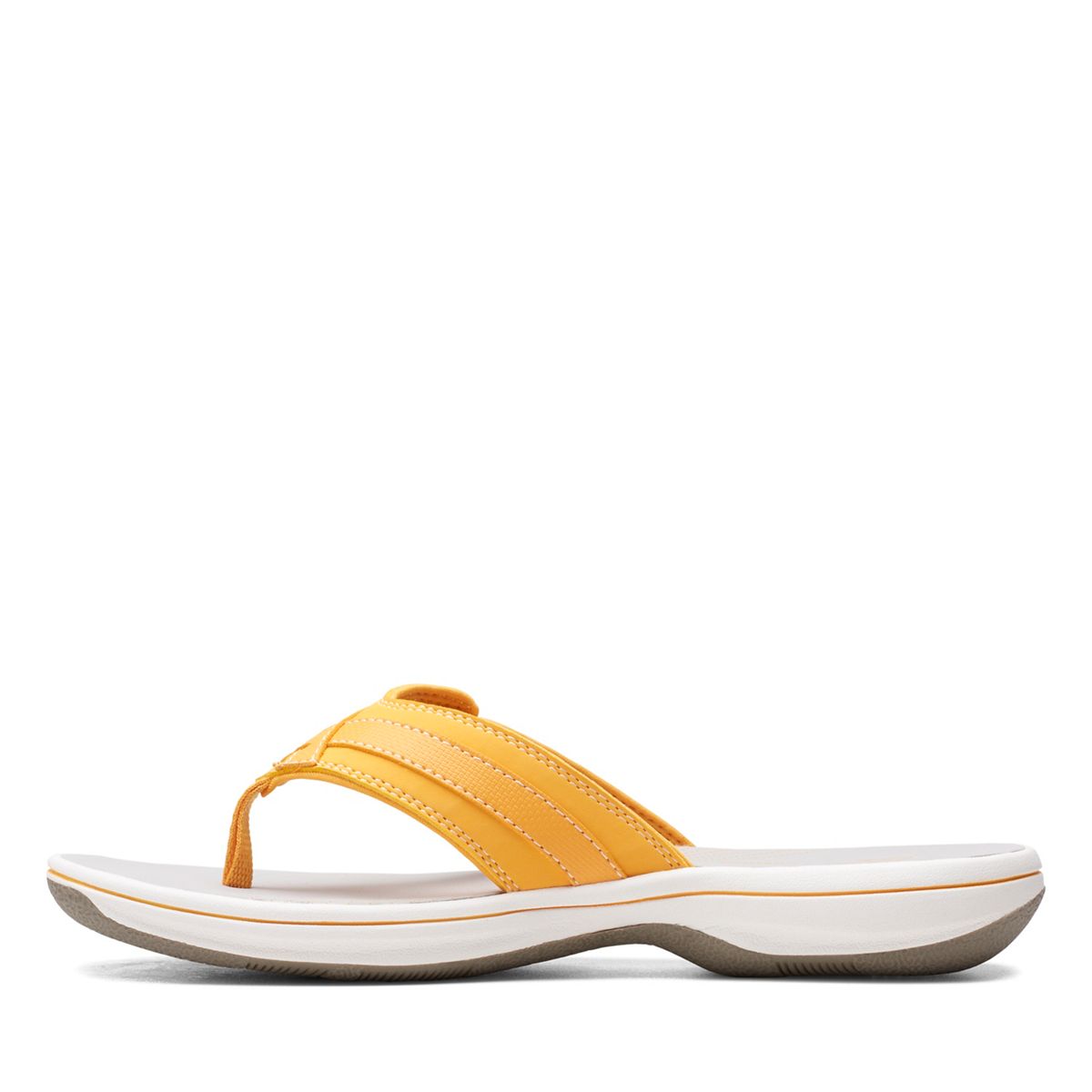 Clarks Breeze Sea flip-flops in burnt yellow with a lightweight sole and adjustable strap closure. left view.