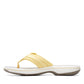 Clarks Breeze Sea yellow flip-flops with a lightweight sole and adjustable strap closure. left view.