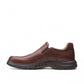 Clarks Un Brawley Step brown leather slip-on shoe with a rounded toe and textured rubber sole. photo of the left side.